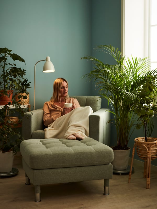 A white LERSTA floor/reading lamp in the living room