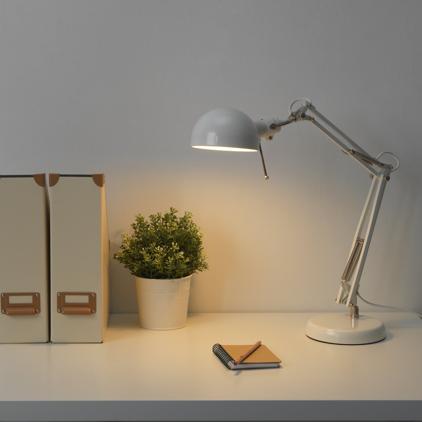 A white FORSÅ work lamp
