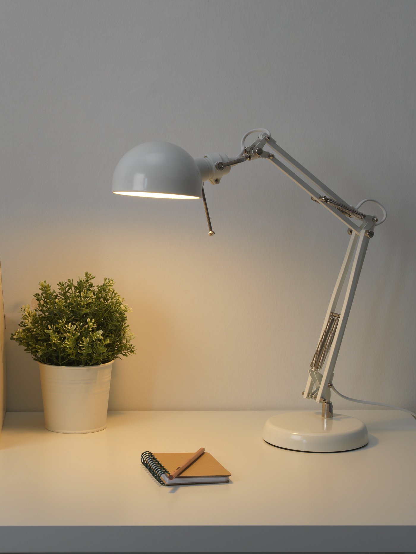 A white FORSÅ work lamp