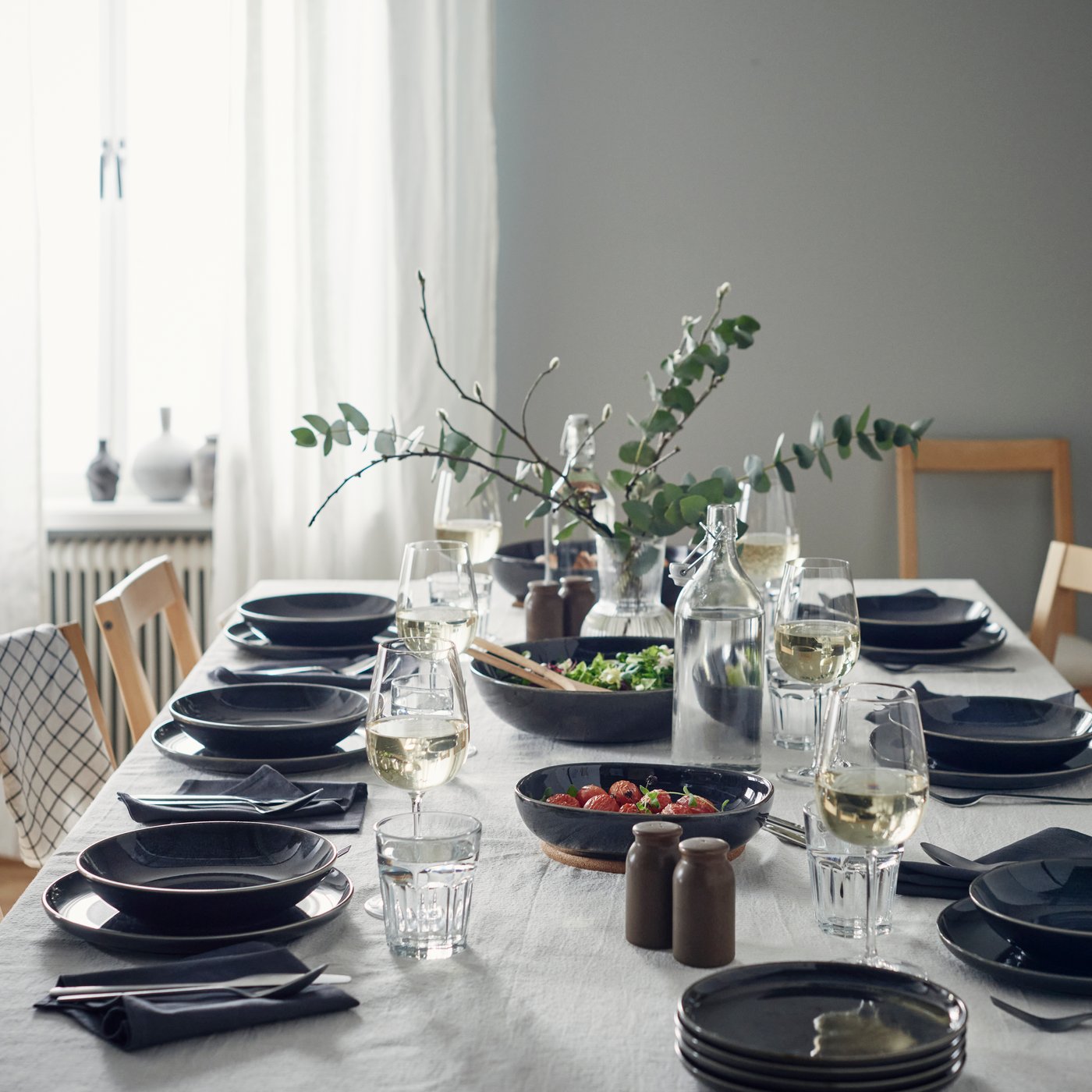 A dark grey GLADELIG side plate