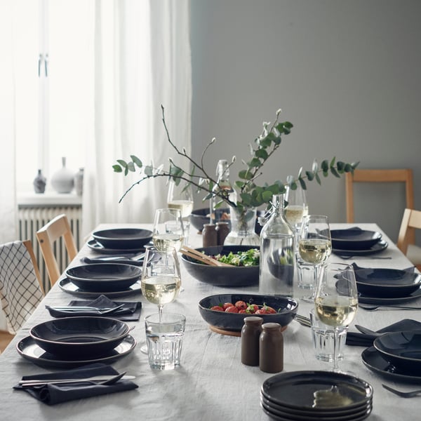 A dark grey GLADELIG side plate