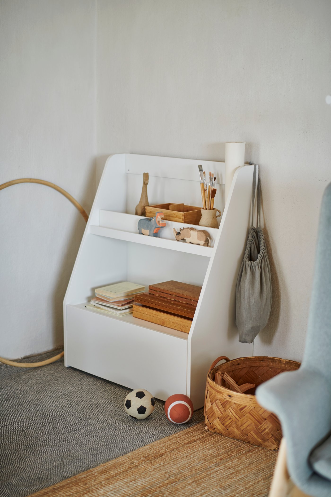 A natural LOHALS rug, flatwoven in the childrens room