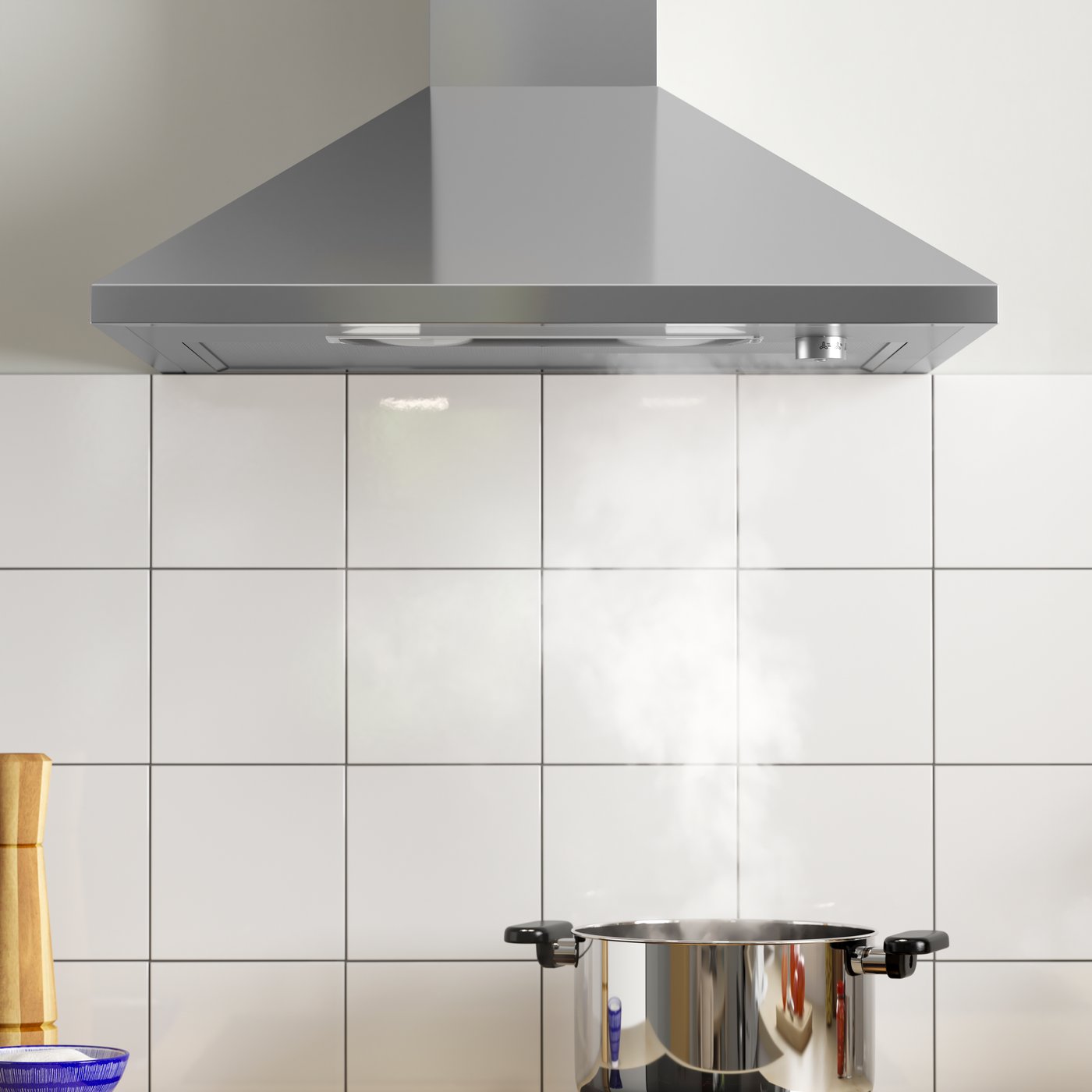 A stainless steel RYTMISK wall mounted extractor hood