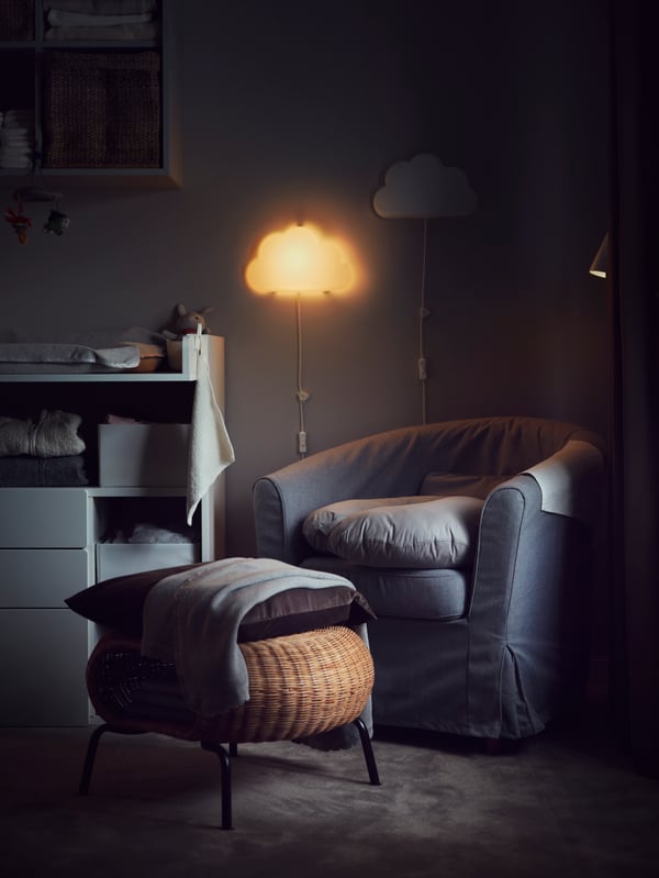 A rattan/anthracite GAMLEHULT footstool with storage in the childrens room