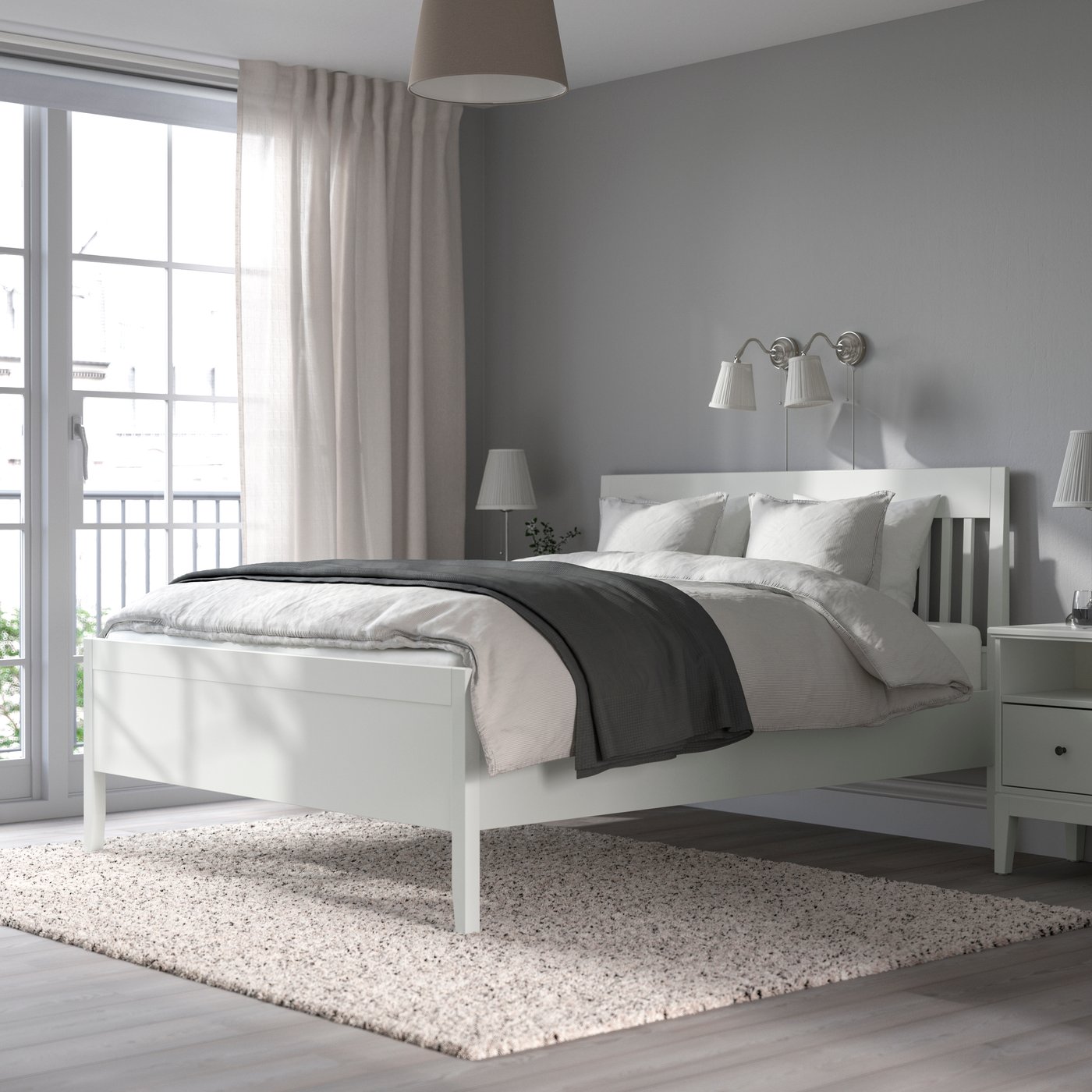 A white IDANÄS bed frame in the bedroom