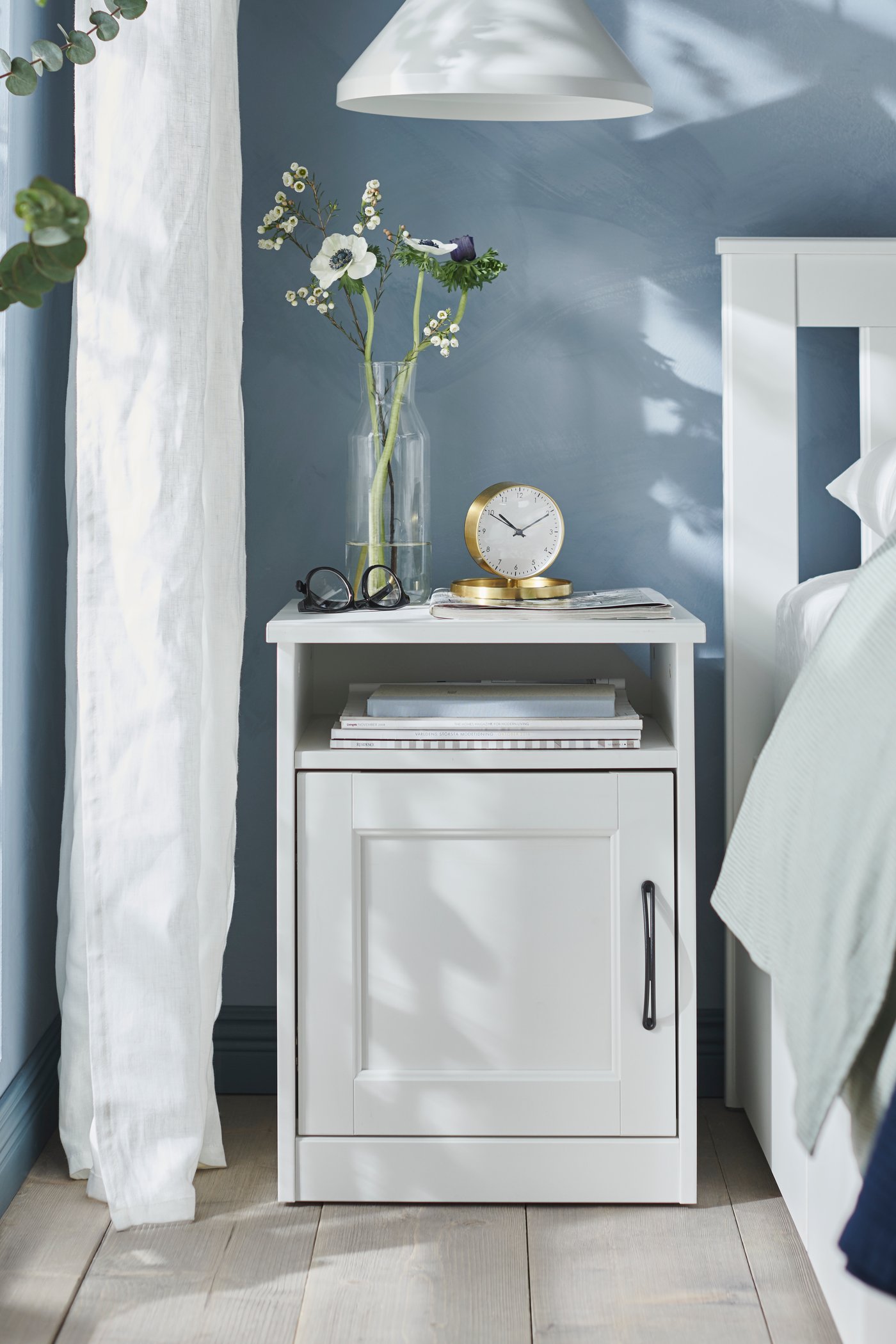 A white SONGESAND bedside table