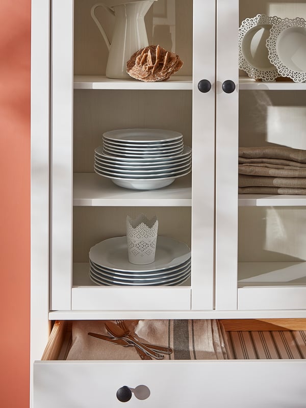 A white stain HEMNES glass-door cabinet with 3 drawers