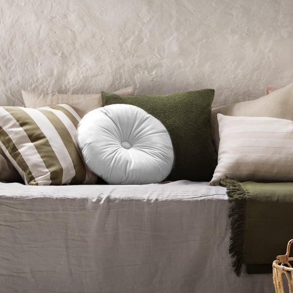 A light pink KRANSBORRE cushion