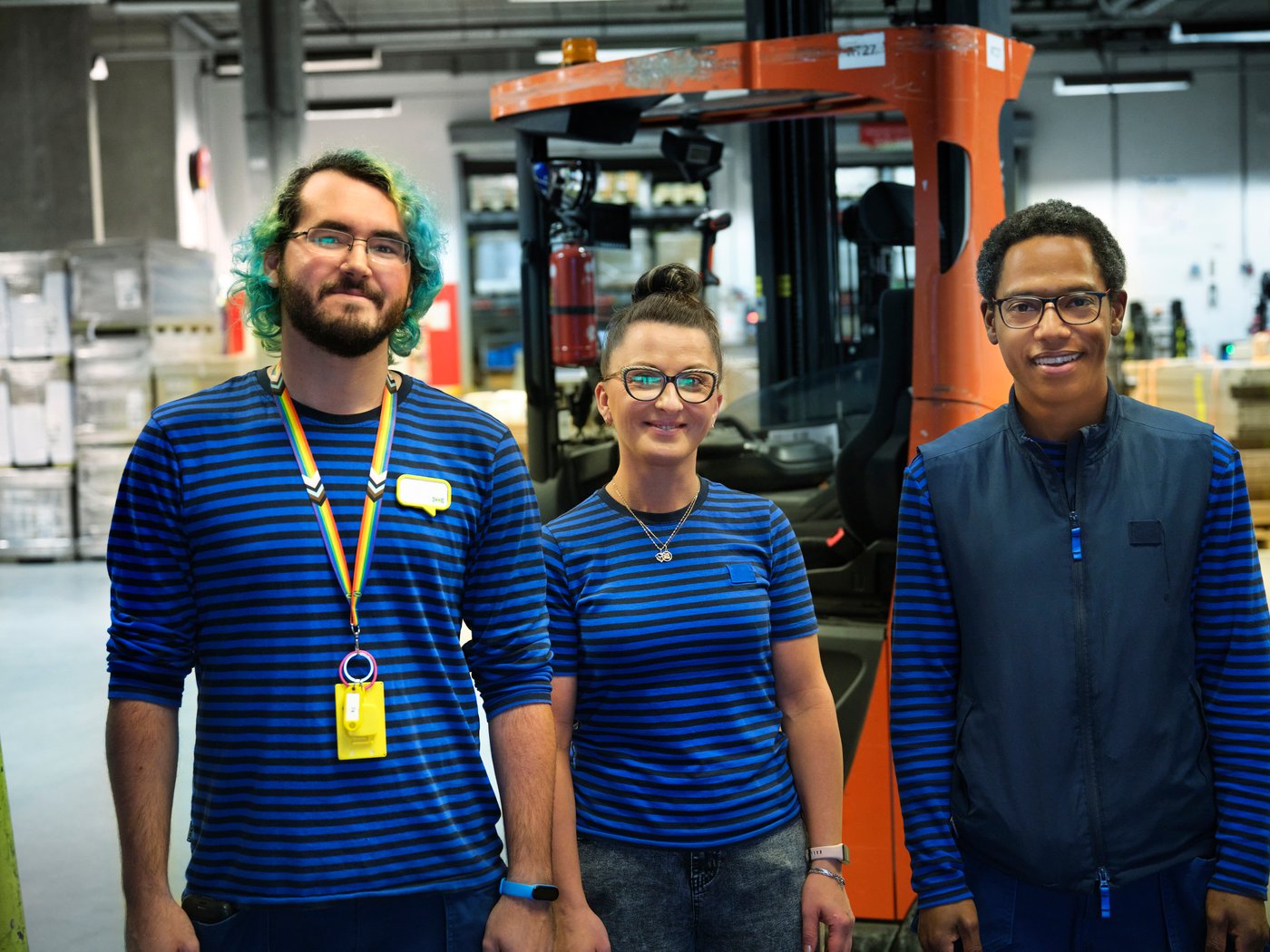 IKEA co-workers standing next to each other in the warehouse