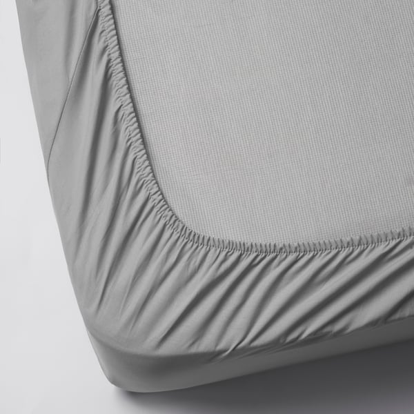 A light grey DVALA fitted sheet