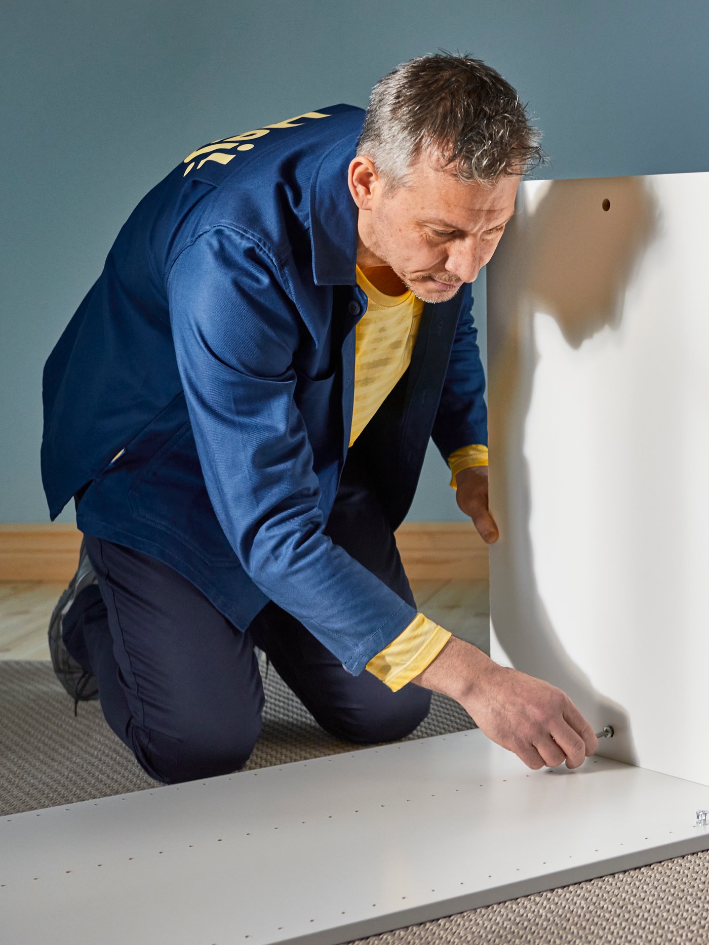 An IKEA coworker providing an assembly service