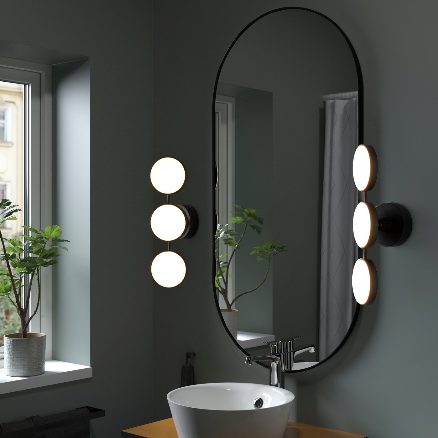 A dimmable matt/black KABOMBA LED wall lamp