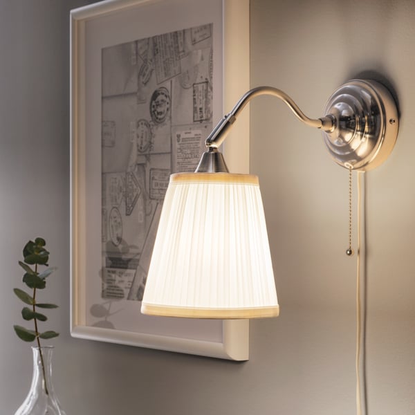 A nickel-plated/white ÅRSTID wall lamp