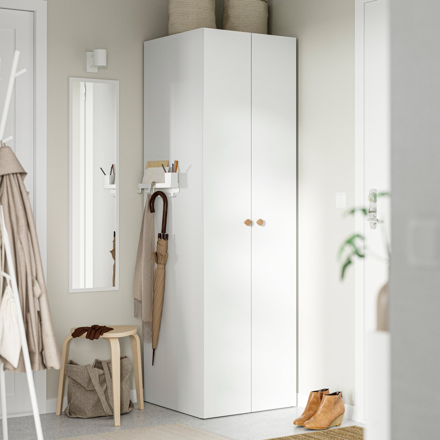 A white LASTARE wardrobe combination in the hallway
