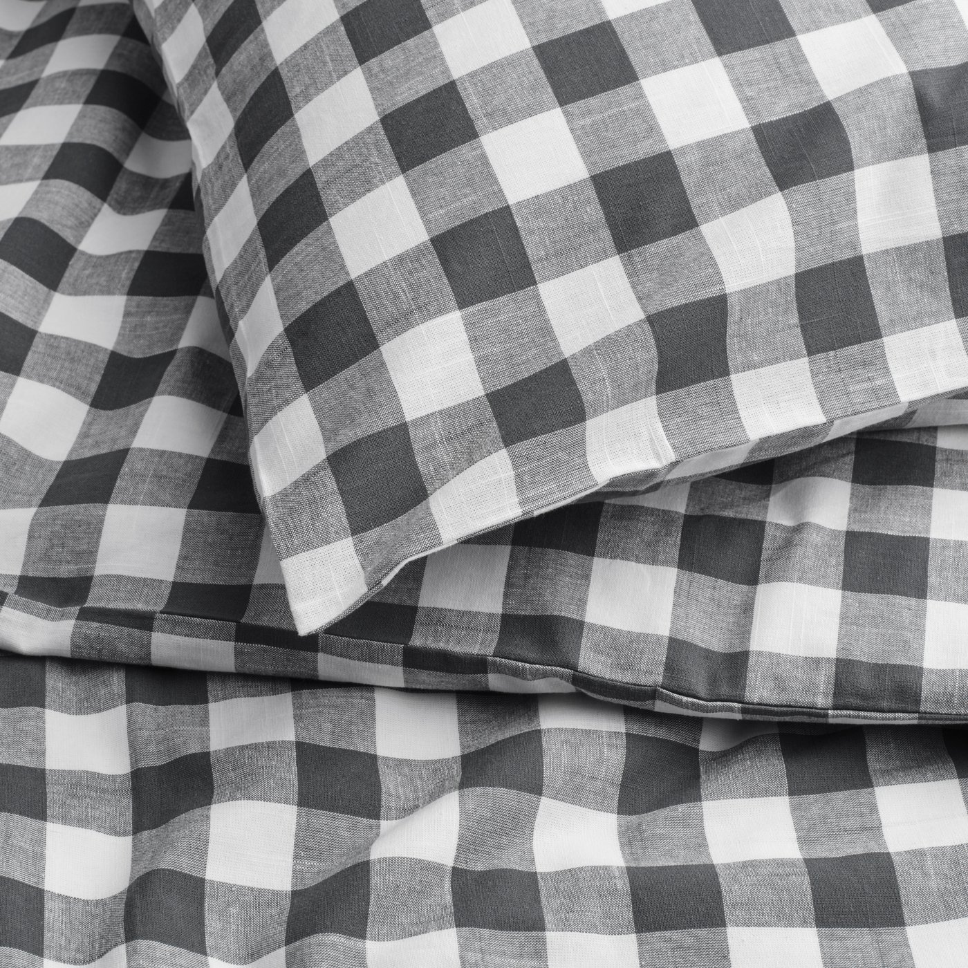 An anthracite white/check EKTANDVINGE duvet cover and pillowcase