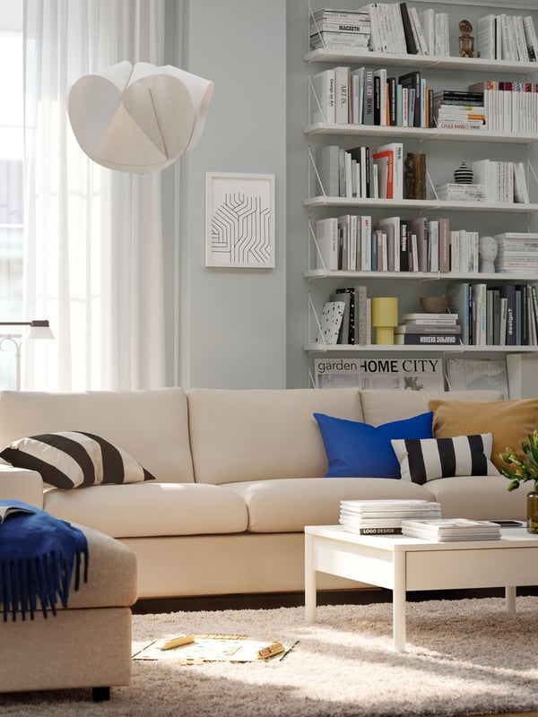 A Hallarp beige VIMLE footstool with storage in the living room
