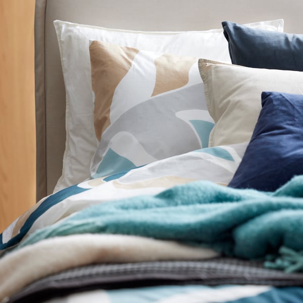 A multicolour MYGGLASVINGE duvet cover and pillowcase