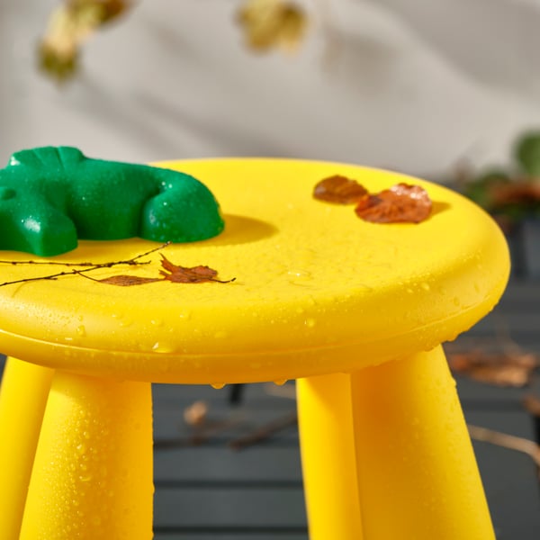 An in/outdoor/yellow MAMMUT children's stool