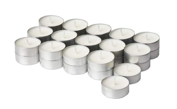 A Vanilla/light beige JÄMLIK scented tealight in the NA