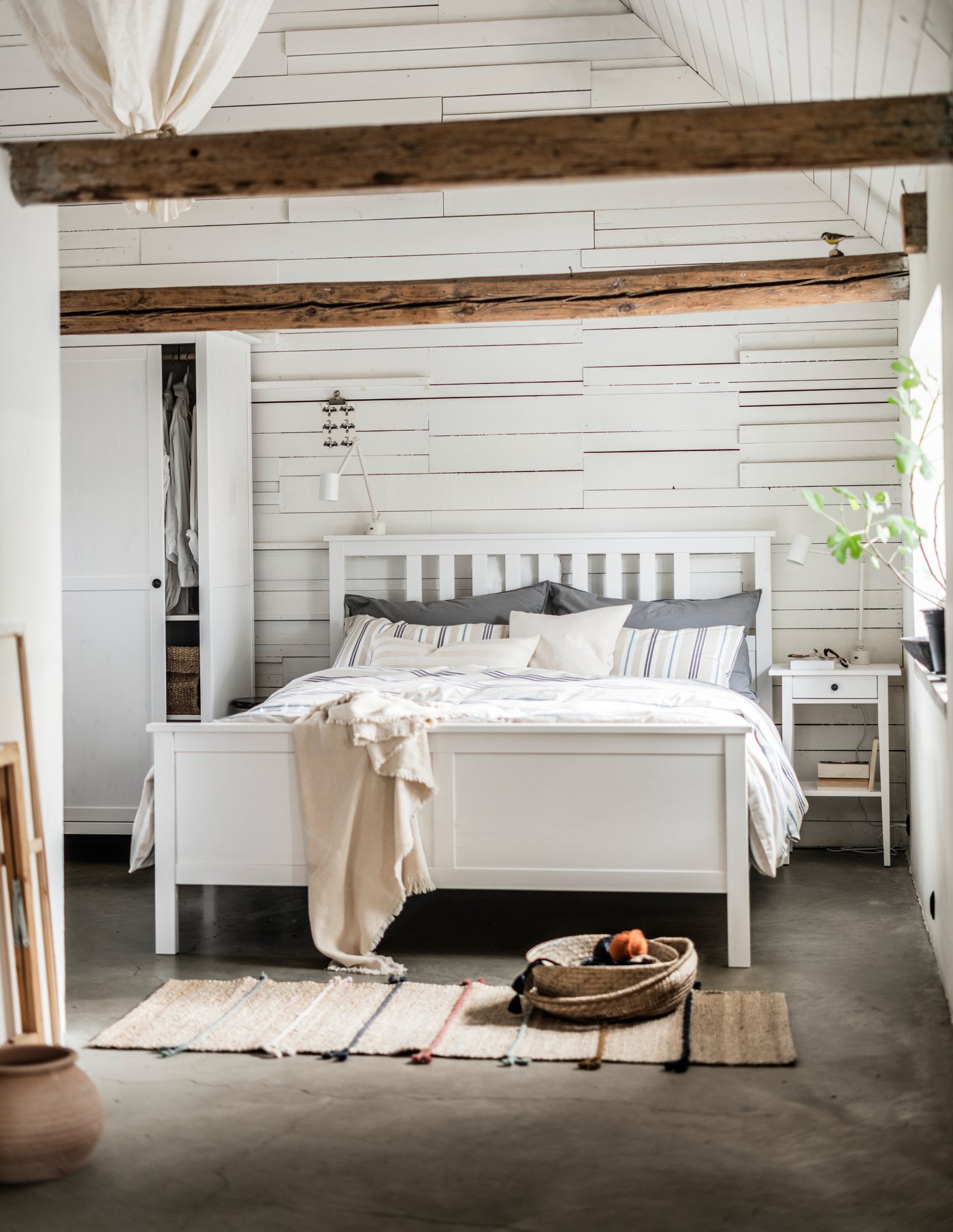 A white stain HEMNES bedside table in the bedroom