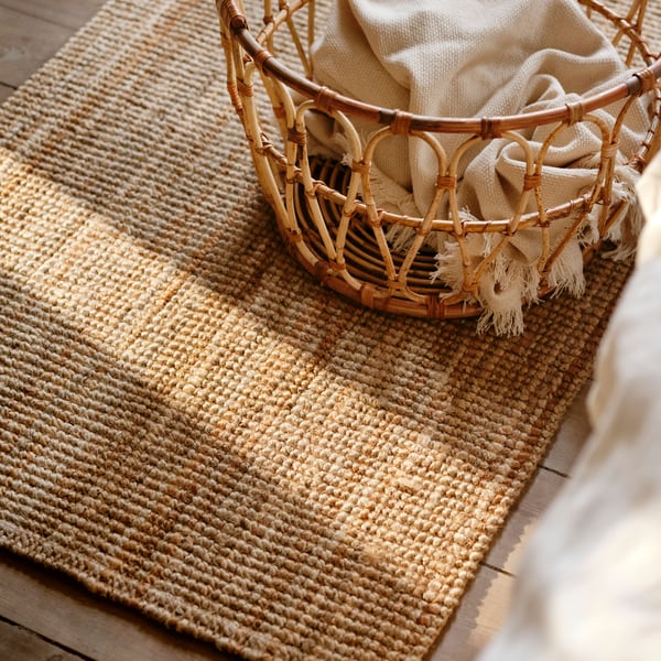 A natural LOHALS rug, flatwoven