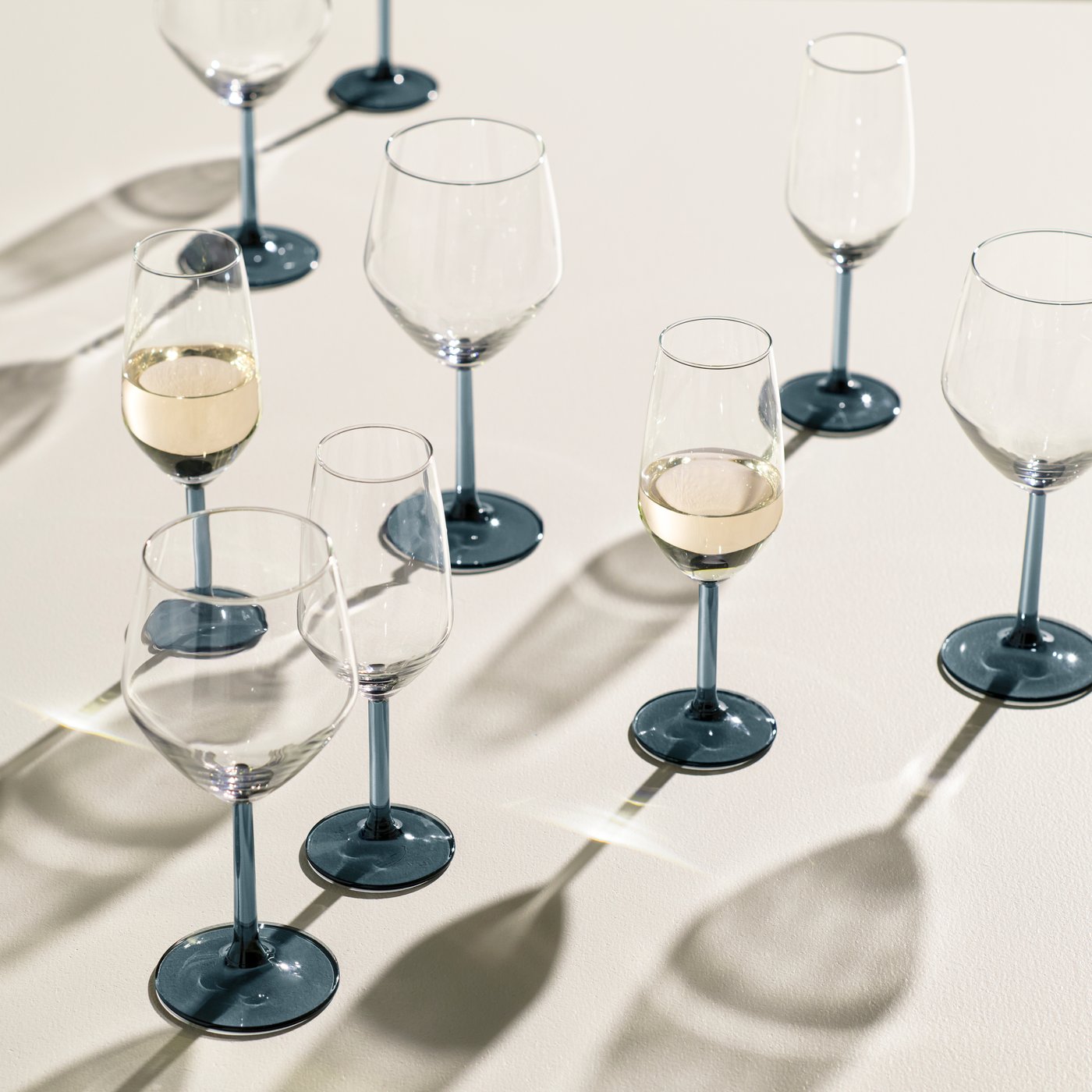 A blue-grey/clear glass RÖDRÄKA champagne glass in the NA