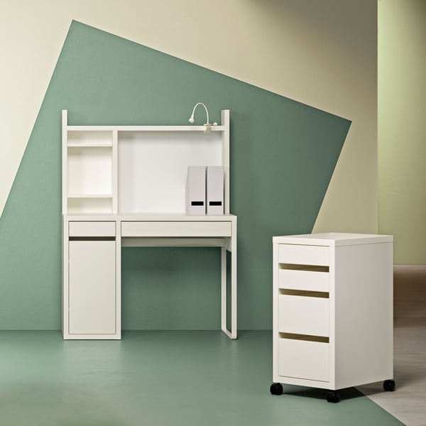 A white MICKE drawer unit with castors