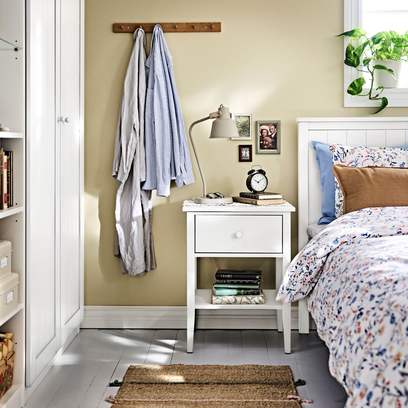 A white/Lönset GULLABERG bed frame with 4 storage boxes in the bedroom