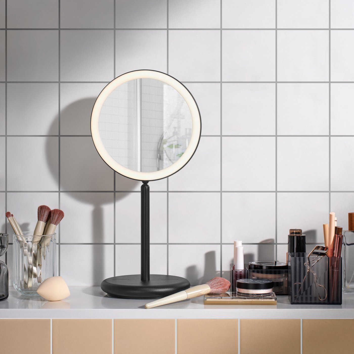 A dimmable/black EKFÄNN table mirror w integrated lighting