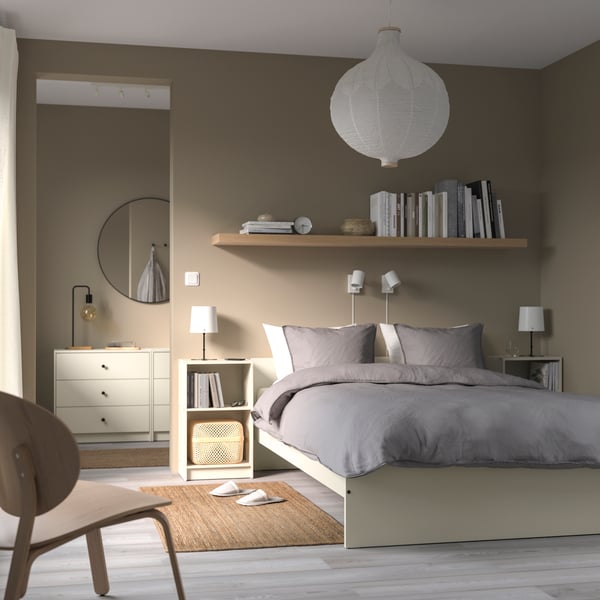 A light beige GURSKEN bed frame with headboard