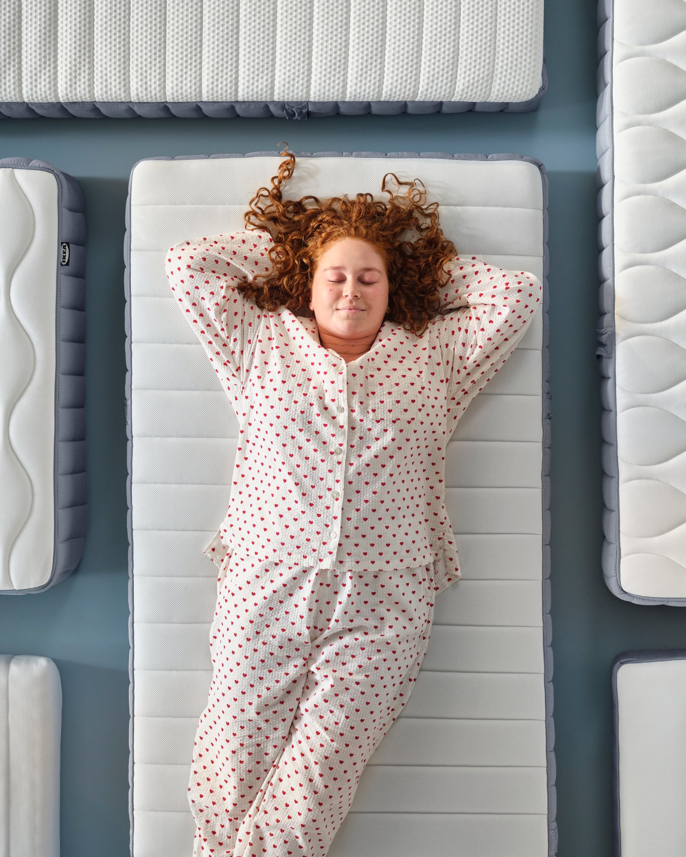 A firm/light blue VALEVÅG pocket sprung mattress