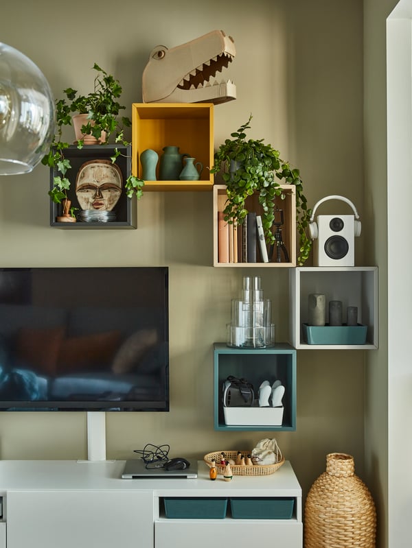  IKEA EKET wall storage cubes around a BESTA TV unit. In various colours
