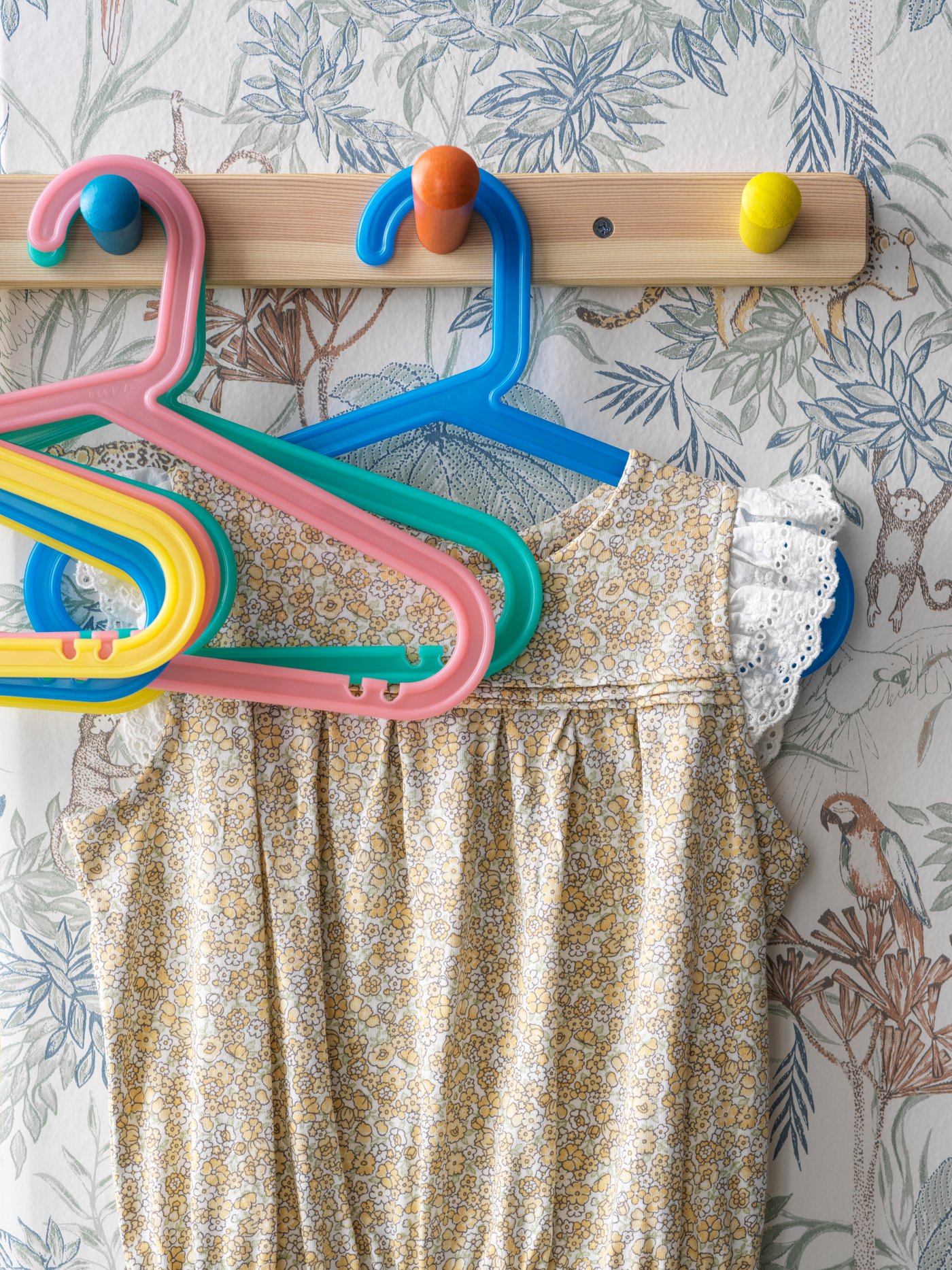 BAGIS hangers on hook against wall with child's dress