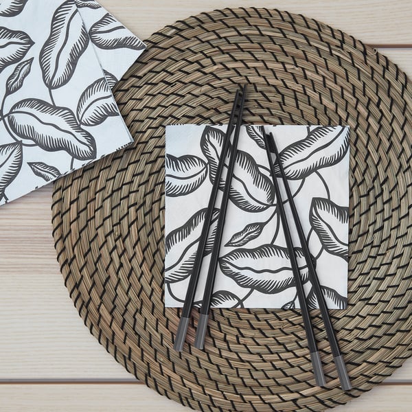 A seagrass/black LÄTTAD place mat