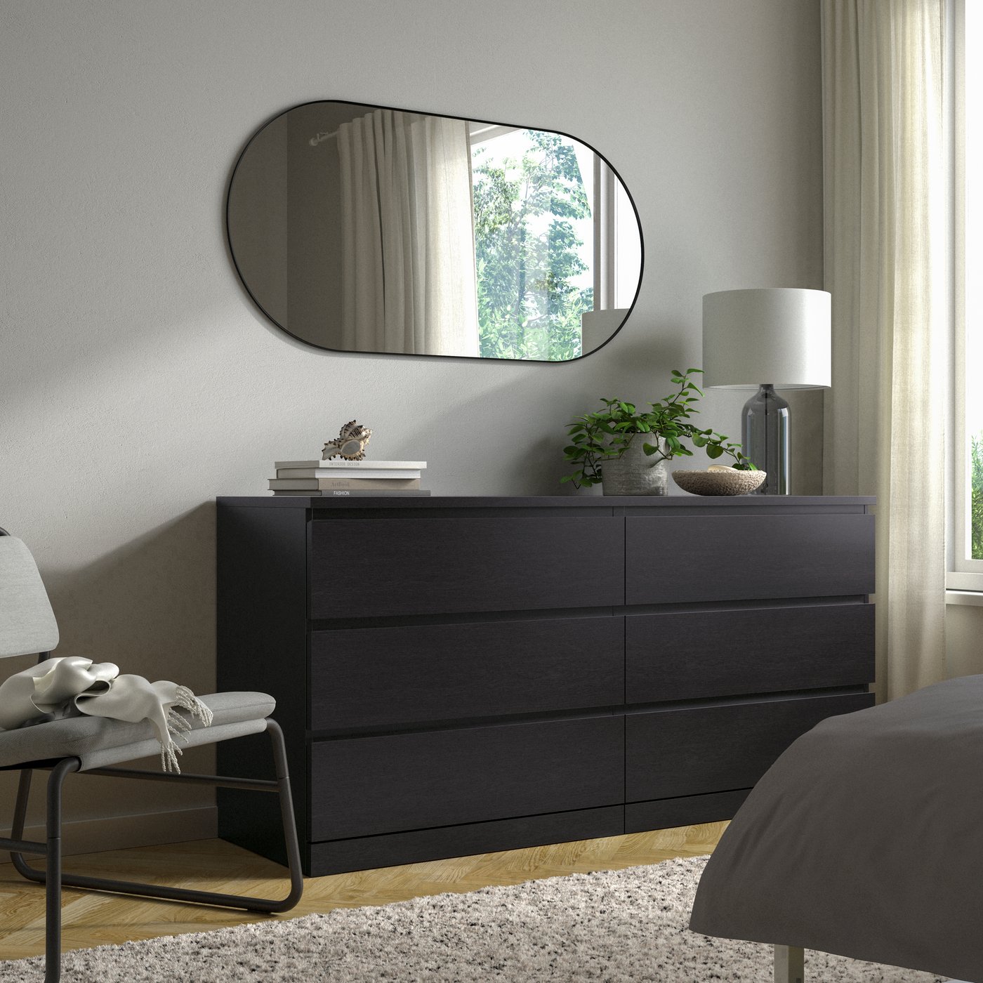 A black-brown MALM chest of 6 drawers