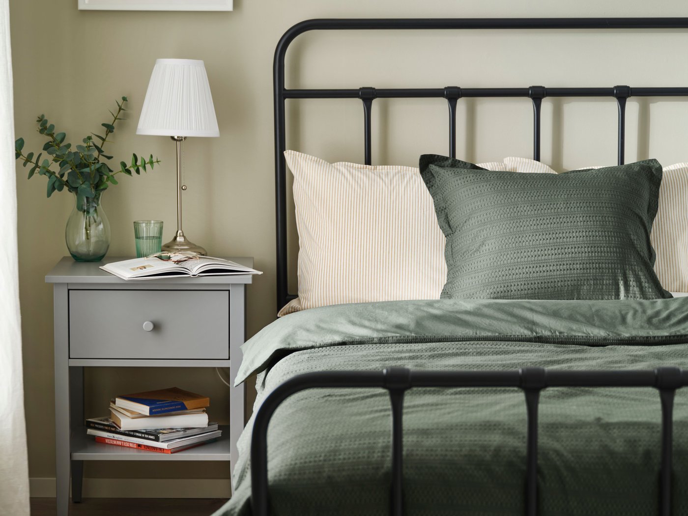 An anthracite STJÄRNÖ bed frame in the bedroom