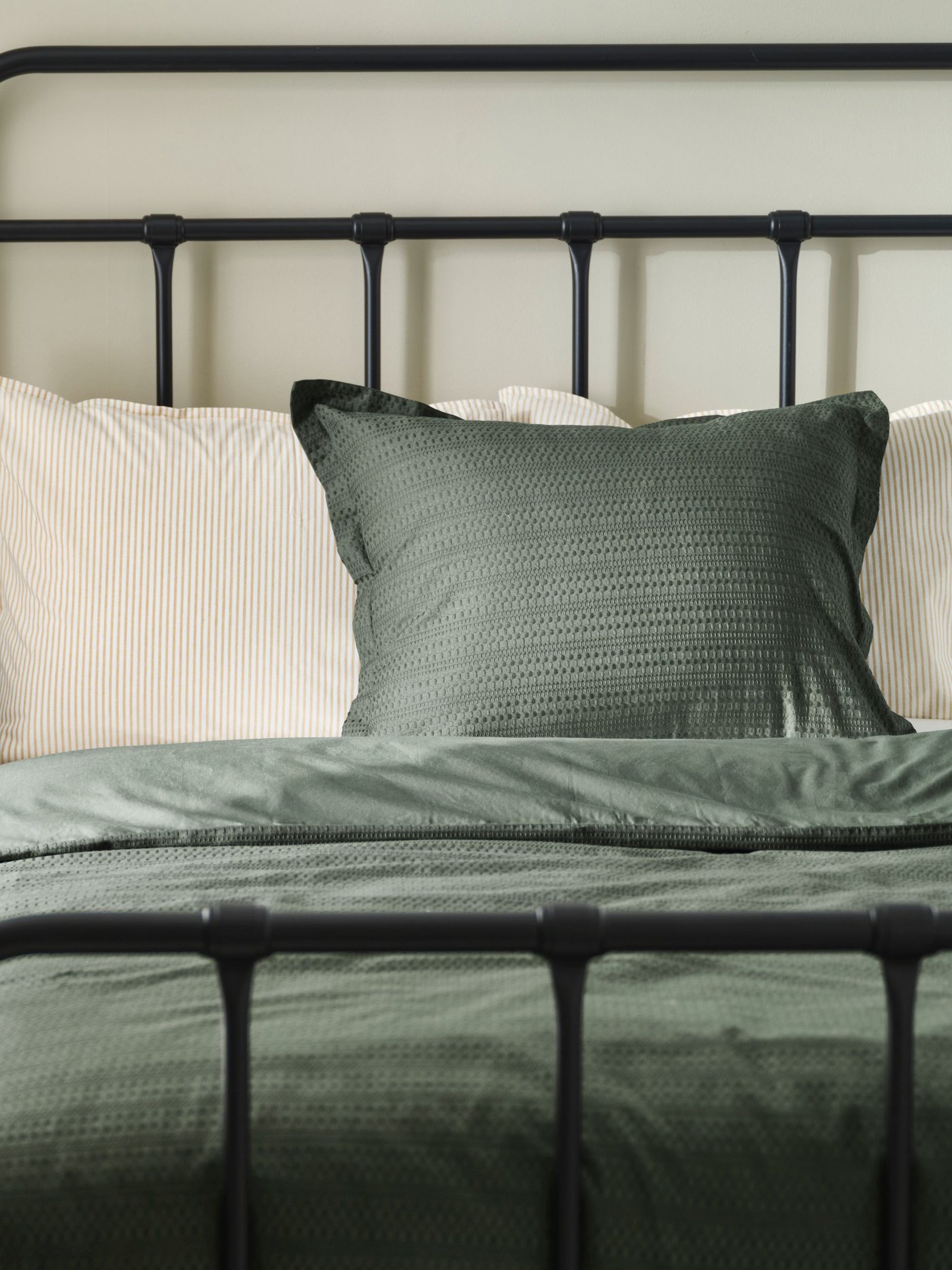 An anthracite STJÄRNÖ bed frame in the bedroom