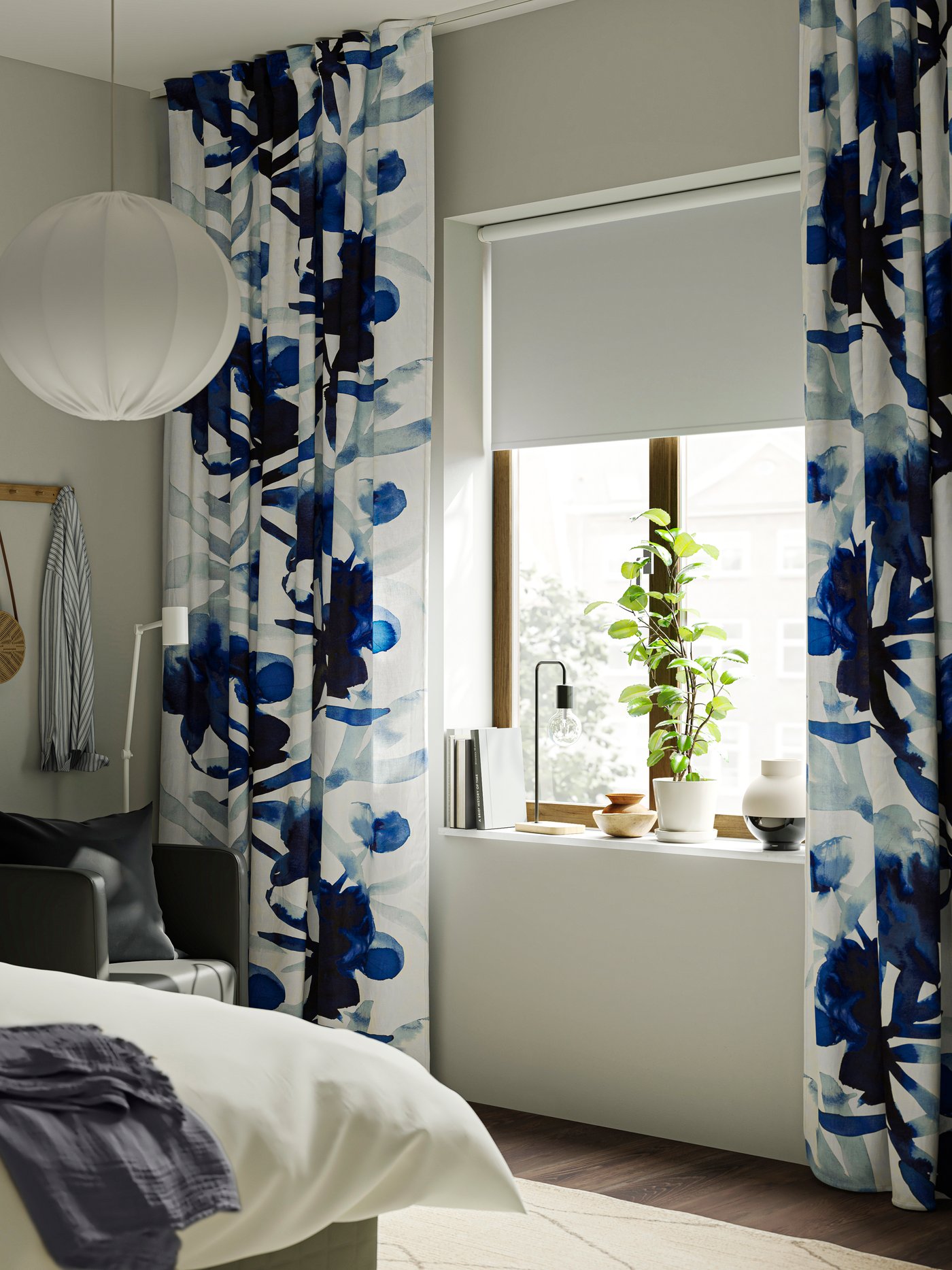 A white/blue floral pattern/with heading tape SKOGSNÄSSLA curtains, 1 pair in the bedroom