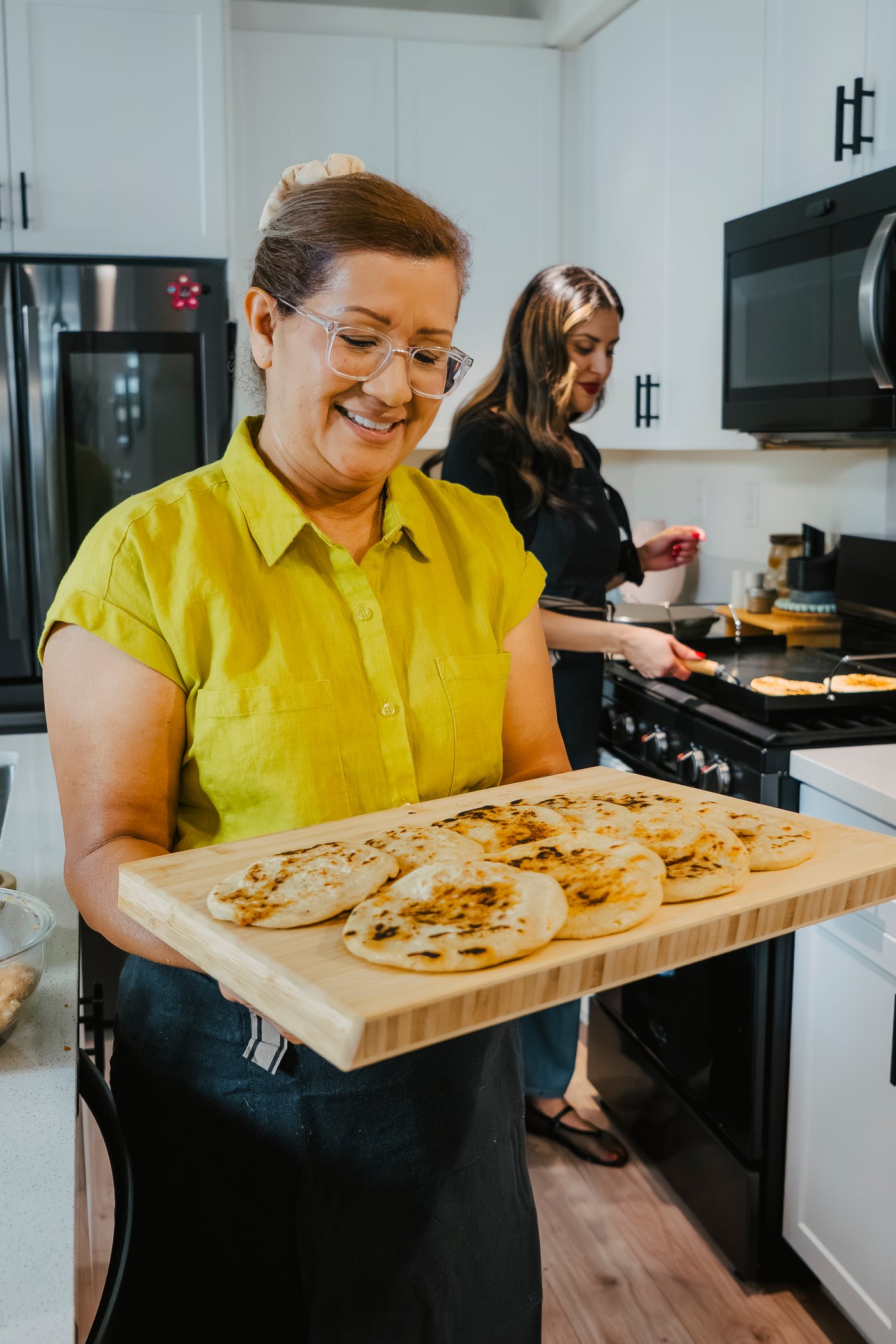 Magaly Tompkins preparing pupusas