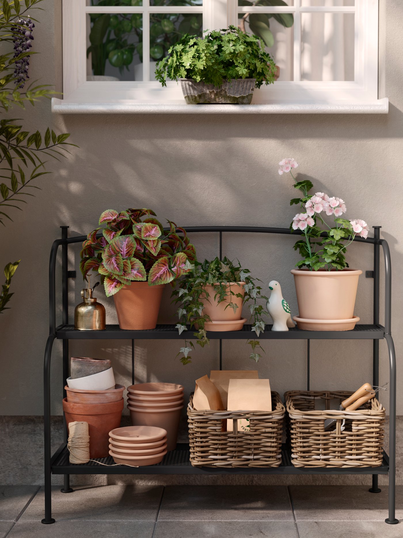A grey outdoor/indoor  LÄCKÖ shelving unit outside