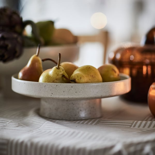 A beige HÖSTAGILLE tablecloth