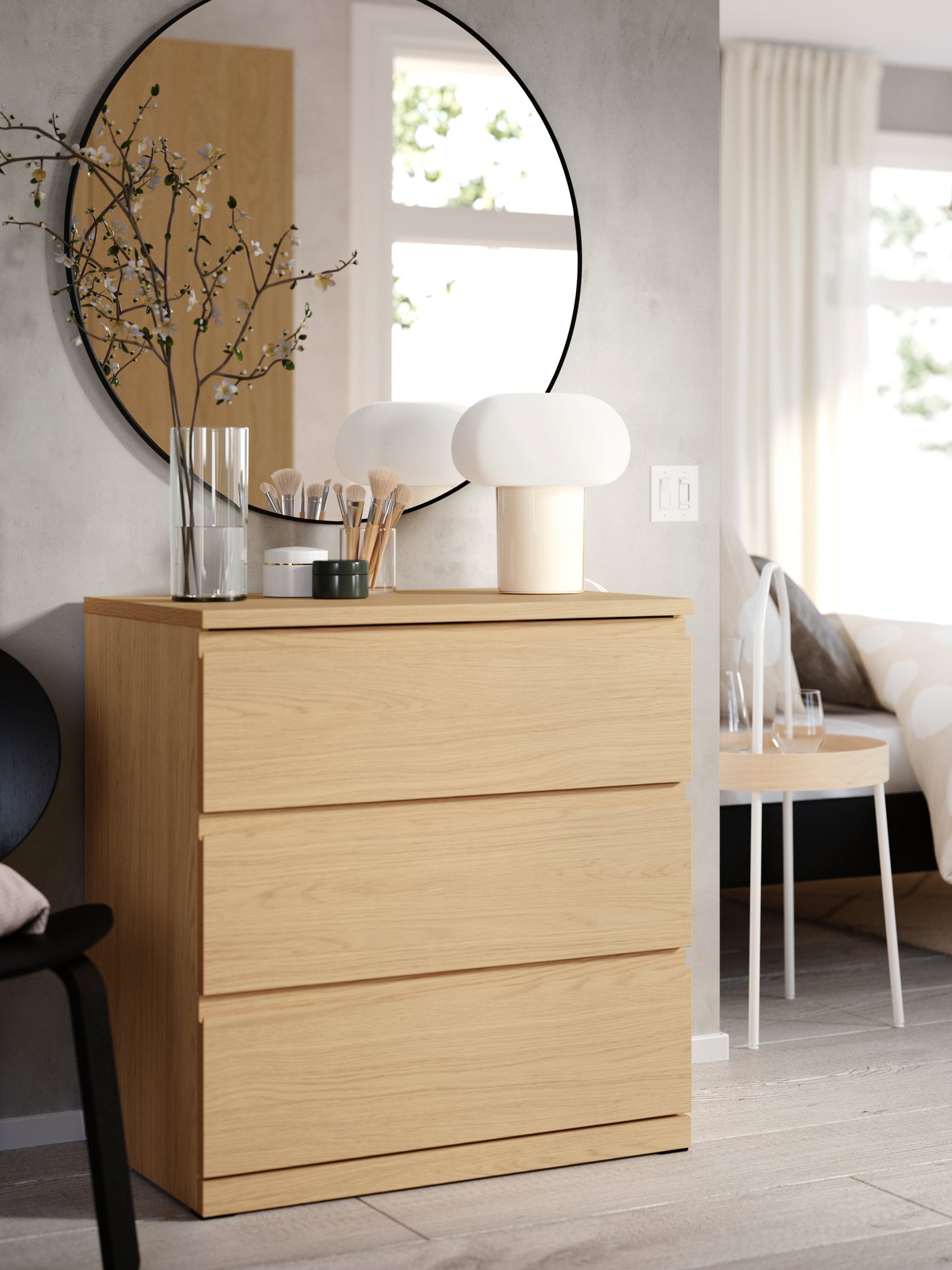 A STORKLINTA chest with 3 drawers in oak effect stands in a hallway outside a bedroom.
