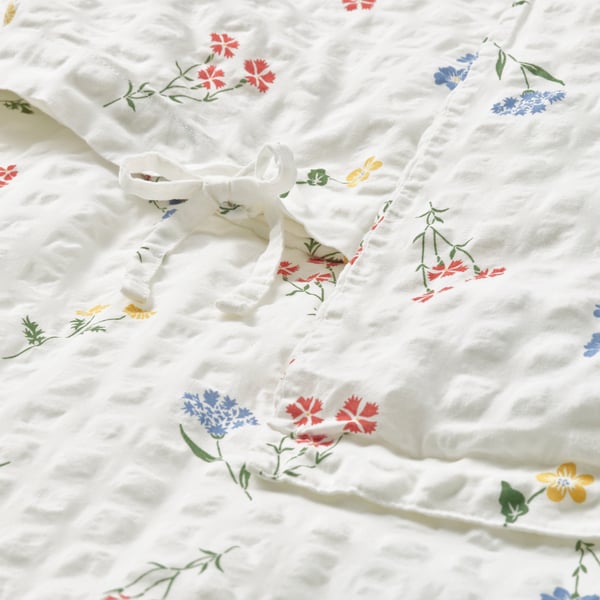 A white/floral pattern PILDVÄRGMAL duvet cover and pillowcase
