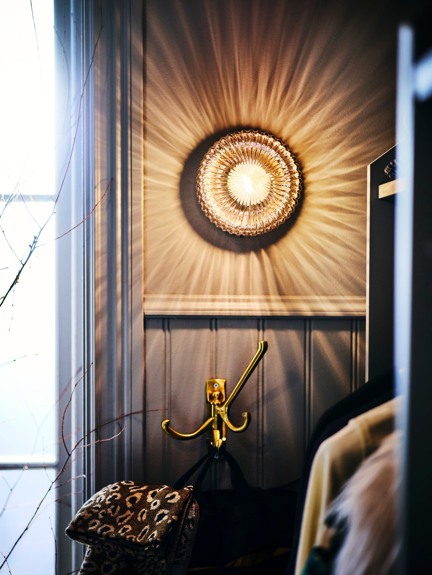 A brass/grey clear glass SOLKLINT wall lamp, wired-in installation in the hallway