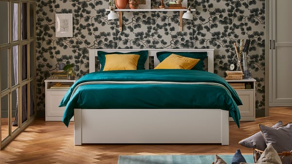 A white SONGESAND bed frame