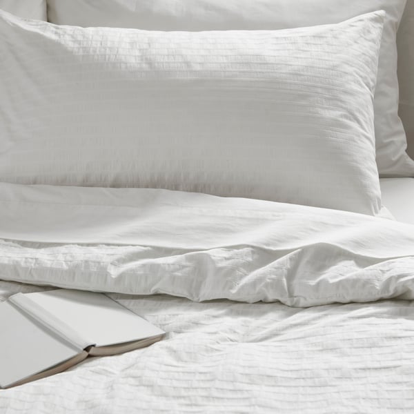 A white OFELIA VASS comforter set