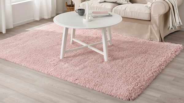 A pale pink VOLLERSLEV rug, high pile