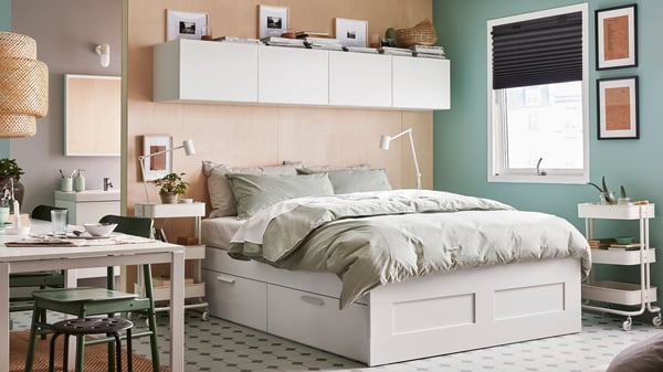 A white/Luröy BRIMNES bed frame with storage