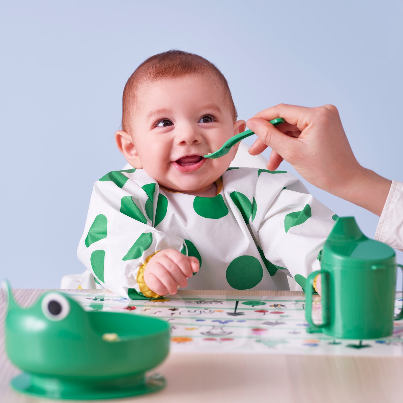 A white/green KLADDIG bib