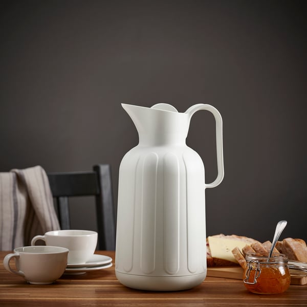 An off-white TAGGÖGA vacuum flask